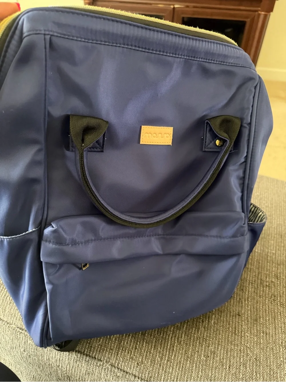 Mouvo Navy Blue Backpack with Tan Logo Patch